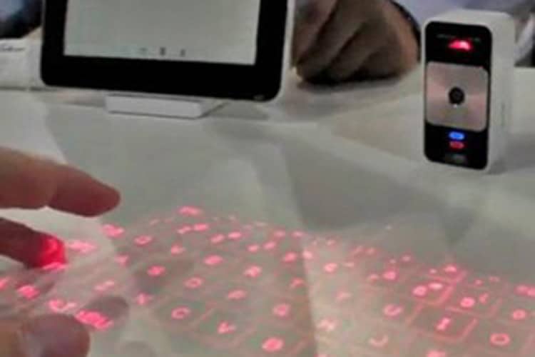 Laser Keyboard being used with a tablet device