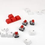 Mechanical keyboard switch on a white background. WASD keyboard buttons. Concept of computer games, gaming and esports