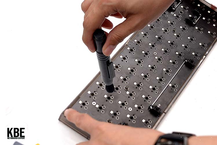 Cleaning the keyboard PCB using soft brush