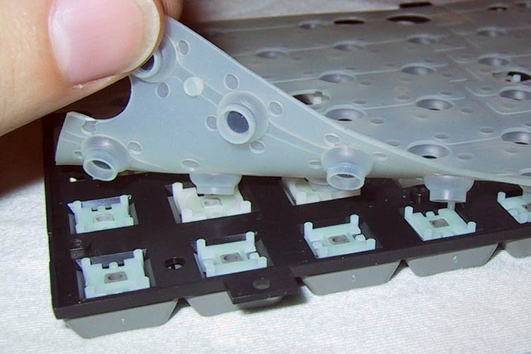 Construction of a typical notebook computer dome-switch keyboard.