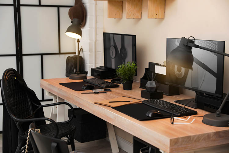 Stylish workplace interior with computers on table